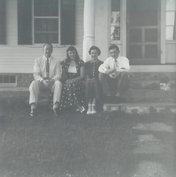 Four people on steps