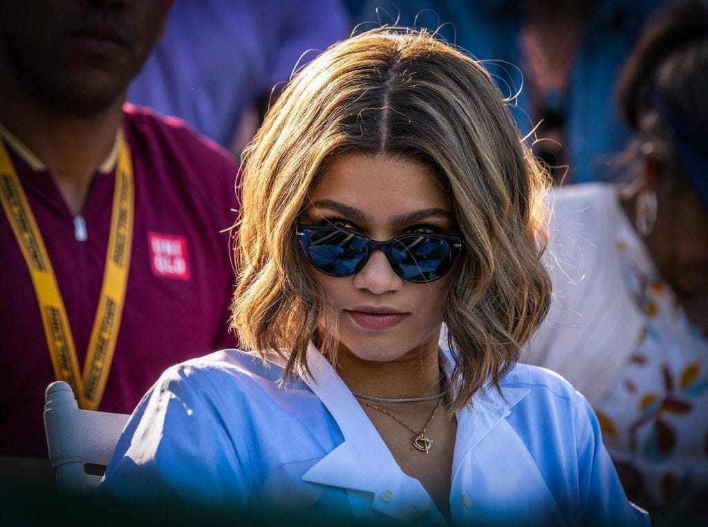 An image from Challengers of Zendaya looking over her sunglasses