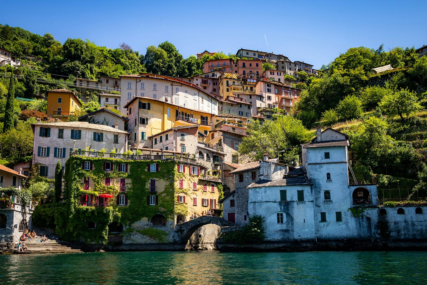 Italian village perched over a green lagoon.