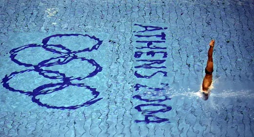 An athlete dives during a training session in the Olympic aquatic center in Athens ahead of the start of the 2004 Olympic Games.