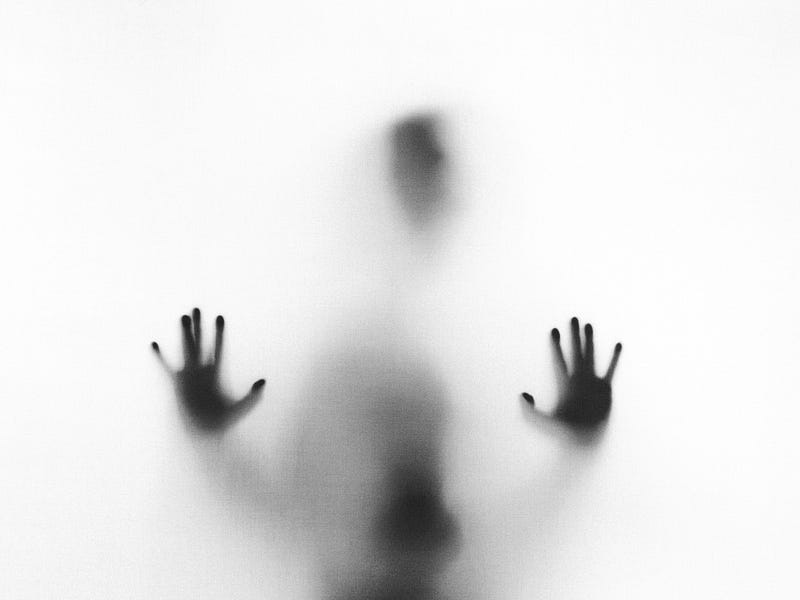 Ghostly figure behind a frosted sheet of glass Ghostly figure behind a frosted sheet of glass