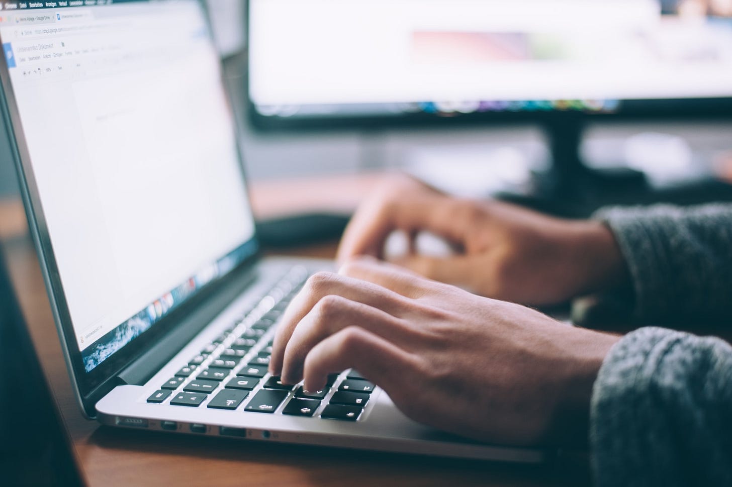 An individual on their laptop reaching out to other sites on their niche to acquire backlinks and increase traffic to their website An individual on their laptop reaching out to other sites on their niche to acquire backlinks and increase traffic to their website