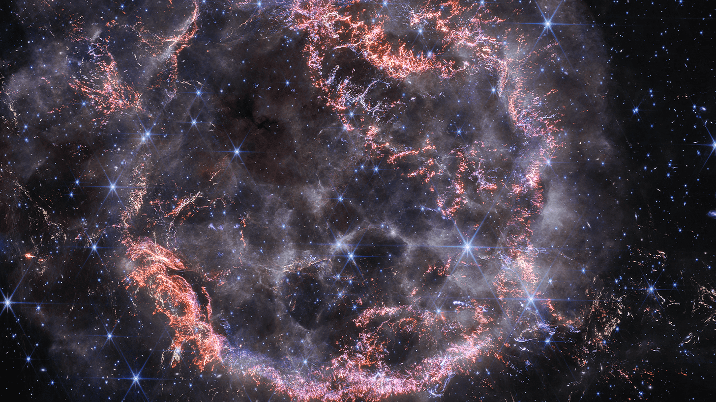 A new high-definition image from NASA’s James Webb Space Telescope’s NIRCam unveils intricate details of supernova remnant Cassiopeia A and shows the expanding shell of material slamming into the gas shed by the star before it exploded. A new high-definition image from NASA’s James Webb Space Telescope’s NIRCam unveils intricate details of supernova remnant Cassiopeia A and shows the expanding shell of material slamming into the gas shed by the star before it exploded.