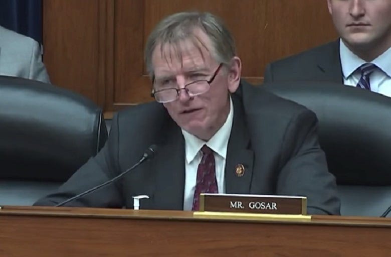 Video screenshot of Rep. Paul Gosar looking very disheveled, his hair splayed all over his forehead
