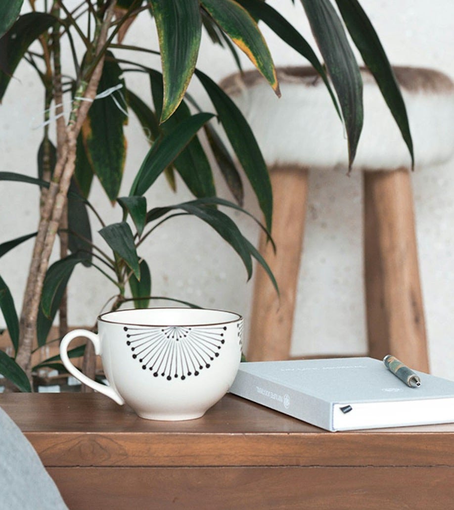 white mug on brown table white mug on brown table