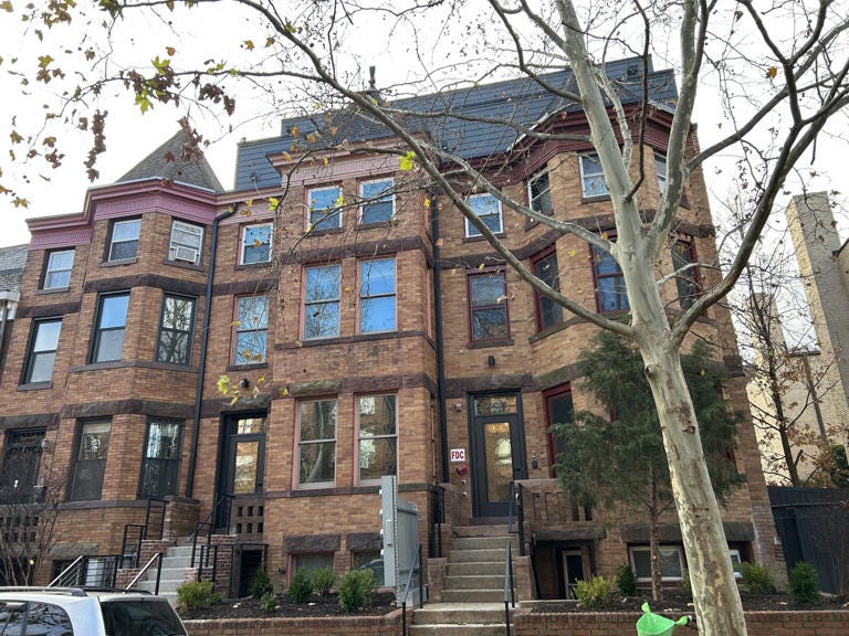 Two adjacent rowhouses on Chapin Street NW were combined and renovated to form the first Cohabs building in D.C. There is no signage to suggest that the building is different from the other houses on the block. (Photo by Aaron Wiener/The Washington Post)