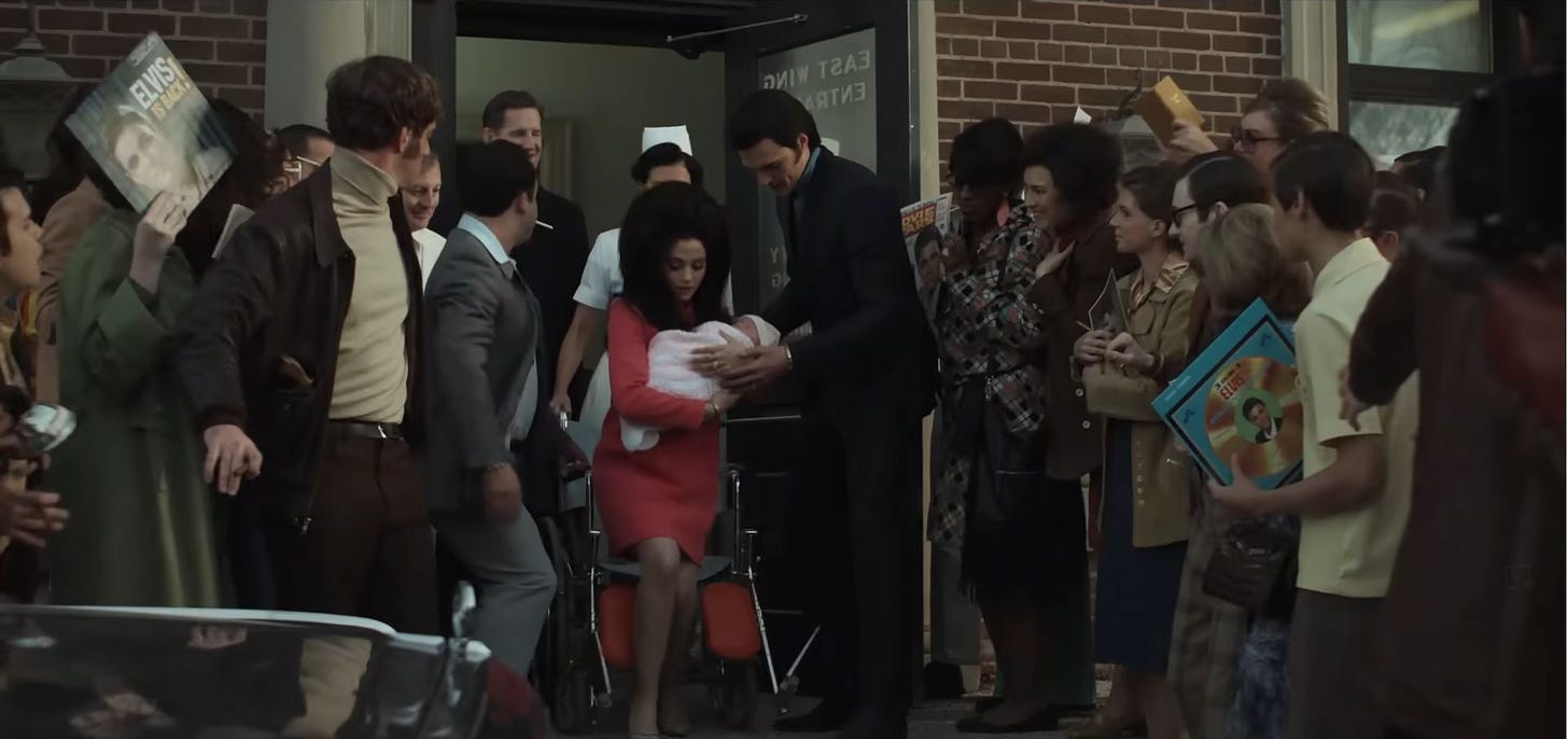 Elvis and Priscilla exit the hospital with their newborn daughter surrounded by onlookers