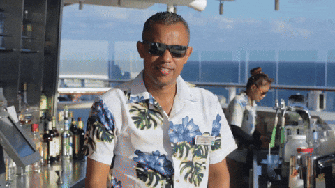 Bartender serving a daiquiri on a Royal Caribbean cruise ship — setting the scene for Beating The Tide’s deep dive stock analysis on RCL and the cruise industry.