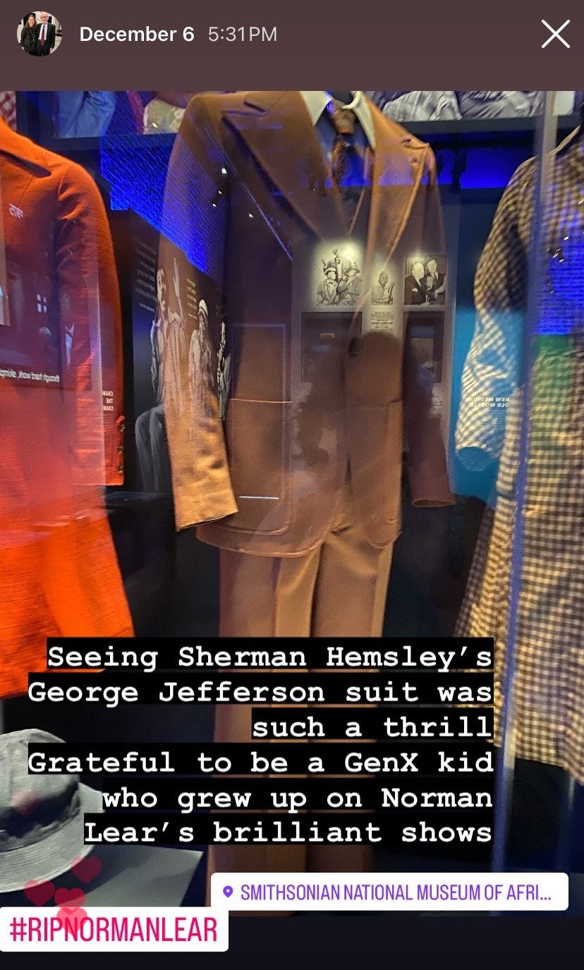 an instagram post featuring the brown suit worn by the character George Jefferson
