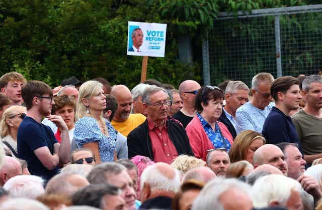 A crowd of people in an audience.