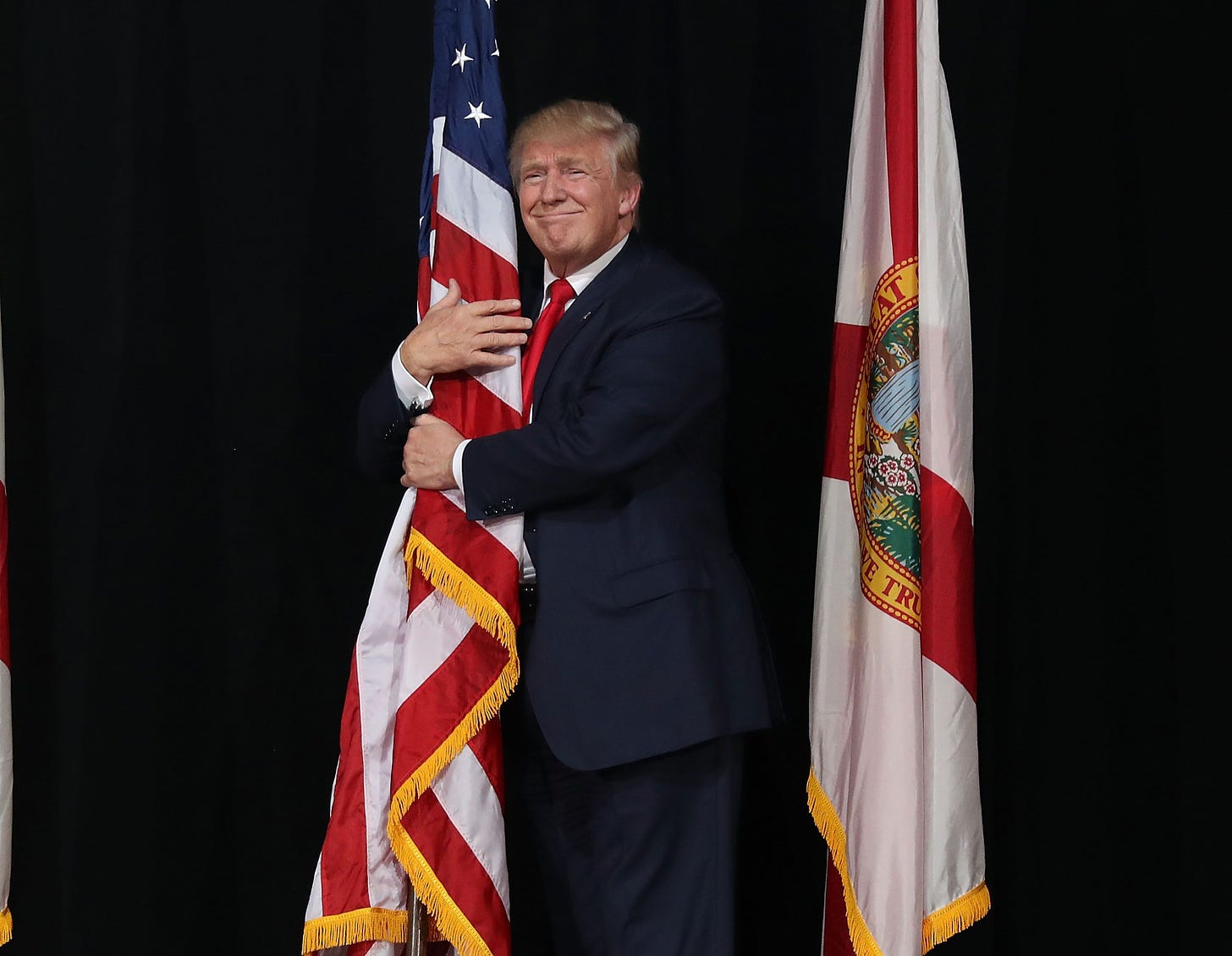To Celebrate Flag Day, the White House Tweeted a Weird Picture of Trump  Hugging Old Glory