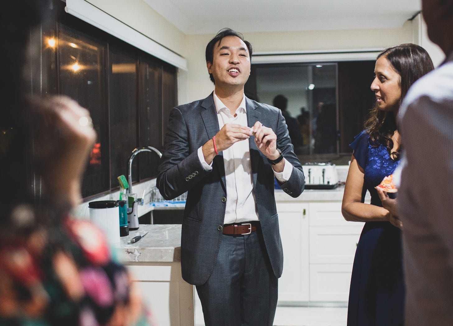 Magician David Ung performing at a birthday party