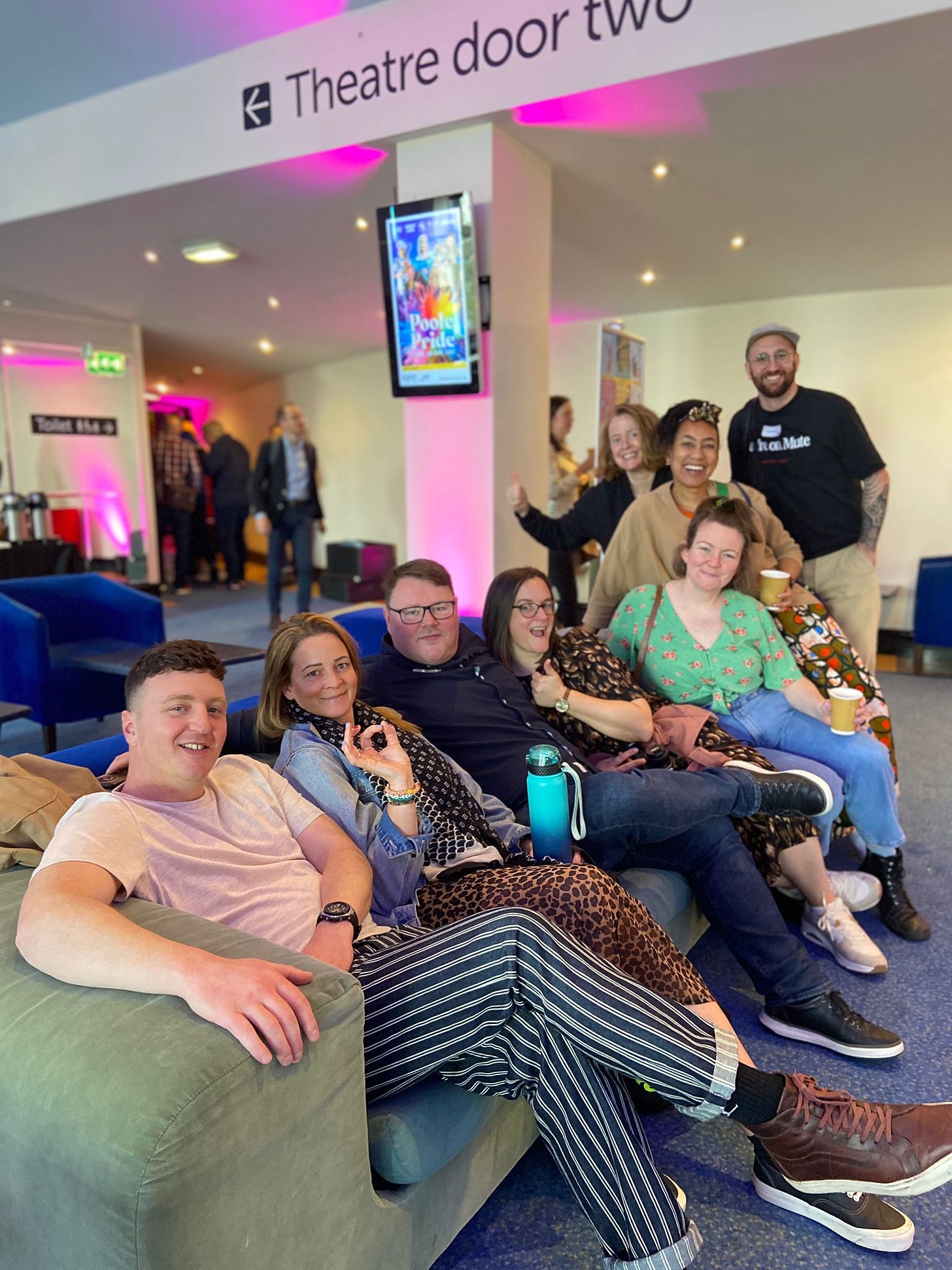 Ben McKinney, Sophie Cross, Dave Harland, Mel Barfield, Molly Scanlan, Ange Lyons, Amy Nolan and Daniel Plume on and near a sofa