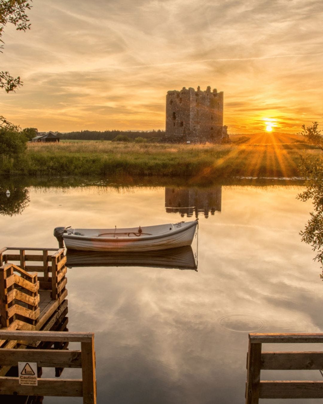 May be an image of boat, nature and castle