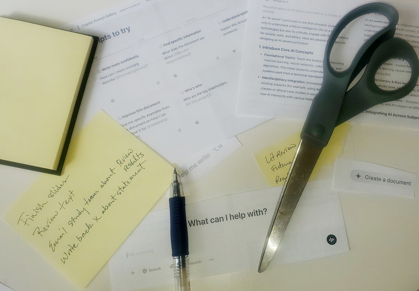 A collage including printed out prompts from AI platforms, handwritten notes, a pen, and a pair of scissors