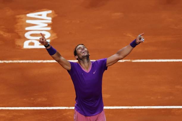 Rafael Nadal of Spain celebrate winning match point over Novak Djokovic of Serbia during the men's final at Foro Italico on May 16, 2021 in Rome,...