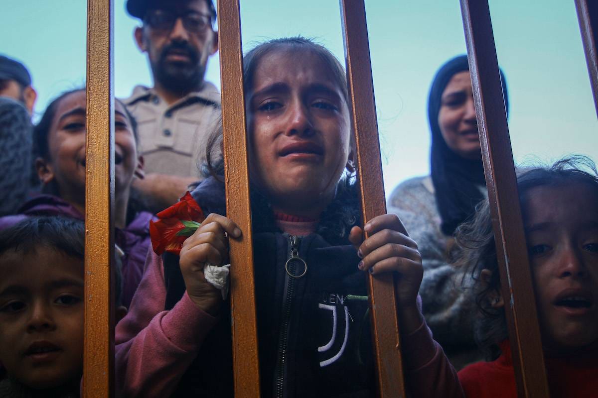 Palestinian children grieve those killed following Israeli airstrikes, at the Nasser Medical Hospital, in Khan Younis, southern Gaza, on Monday, Dec. 11, 2023. [Ahmad Salem/Bloomberg via Getty Images]