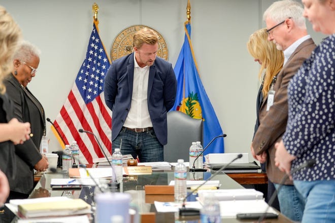 Oklahoma state schools Superintendent Ryan Walters prays at an Oklahoma State Board of Education meeting at the Oliver Hodge Building in Oklahoma City, on Thursday, Sept. 26, 2024.