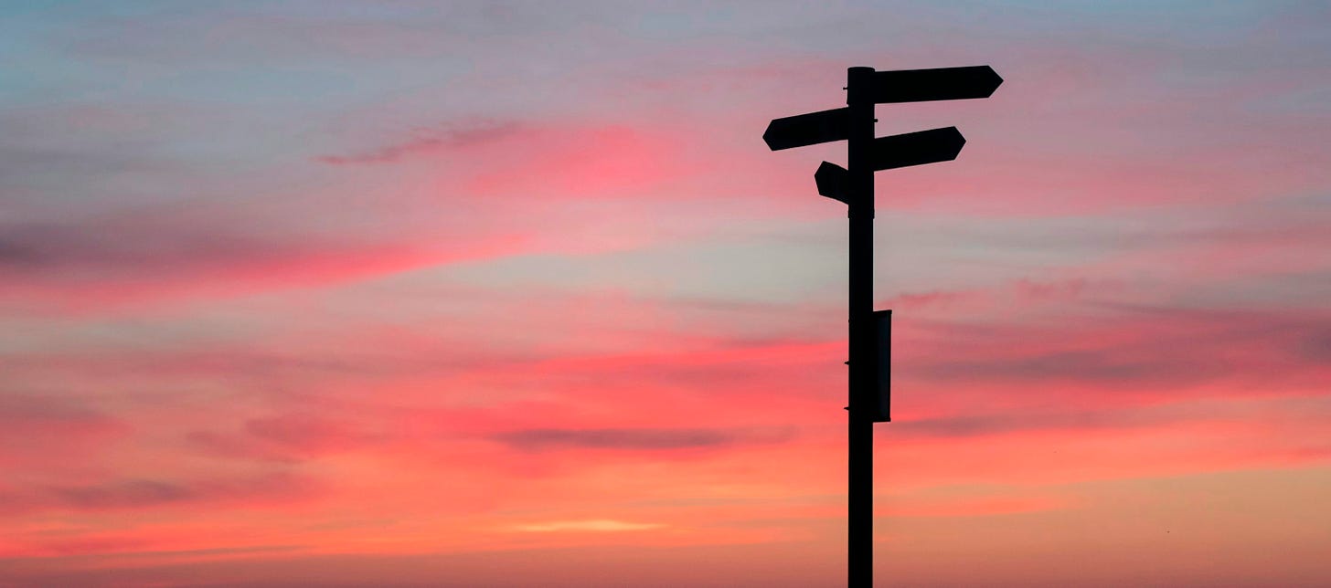 silhouette of road signage during golden hour