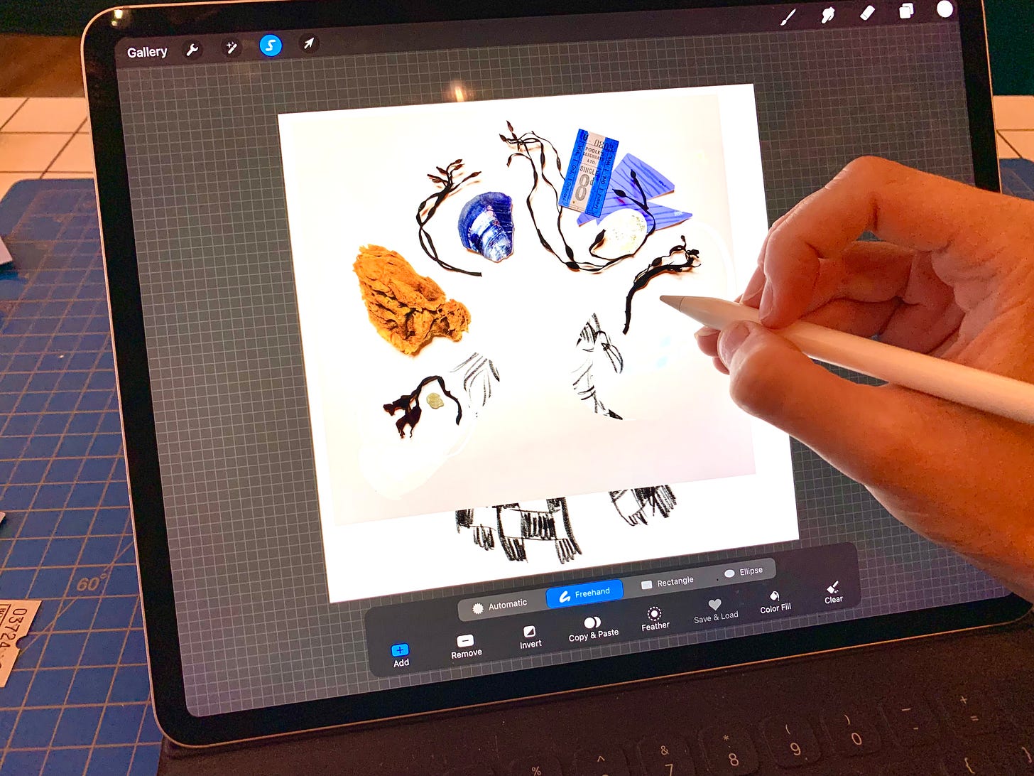 A photo of Gracie's hand holding her Apple Pencil, working in the procreate file, tweaking the photograph she took in the phot before.