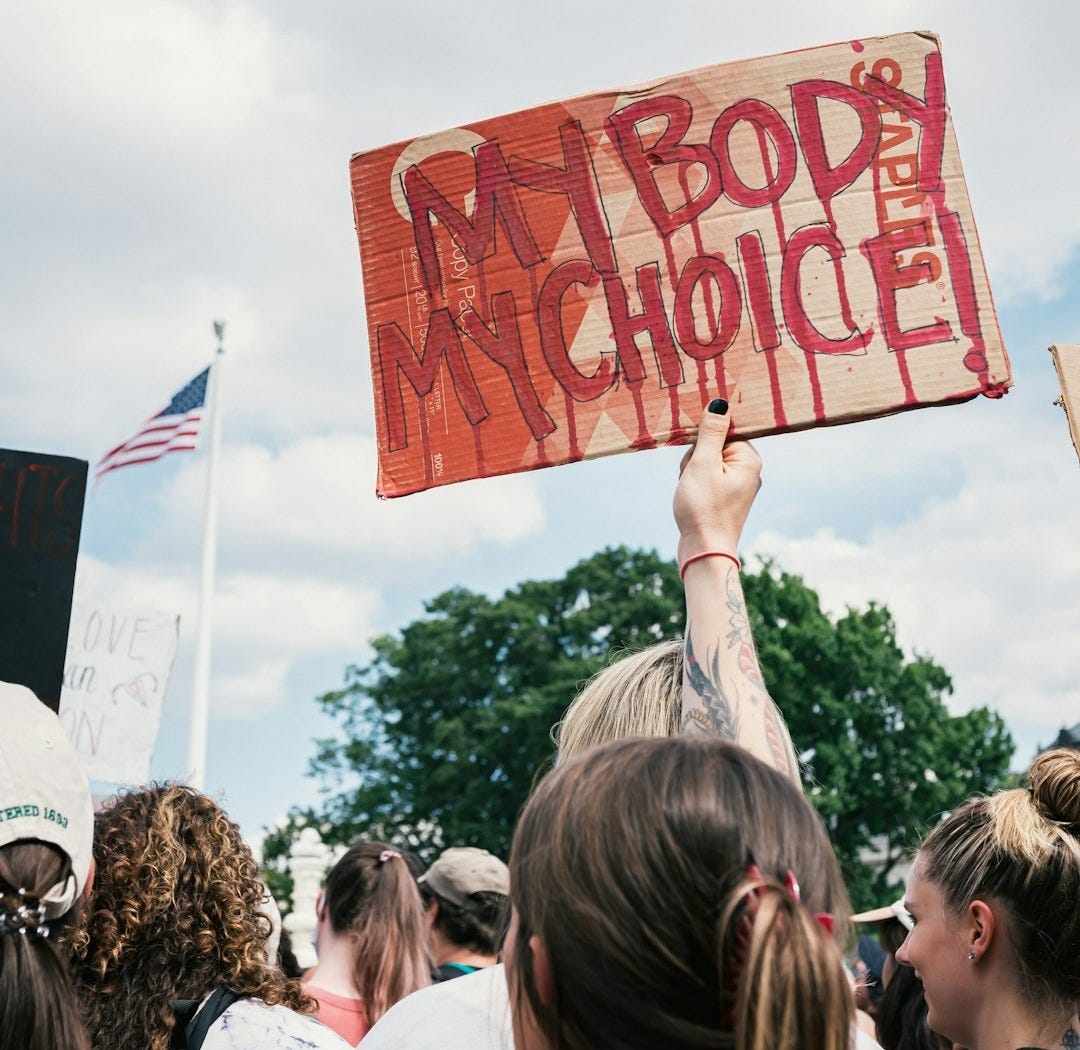 a group of people holding signs