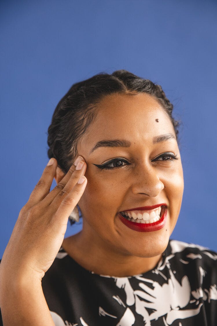 Woman smiling touching side of her face