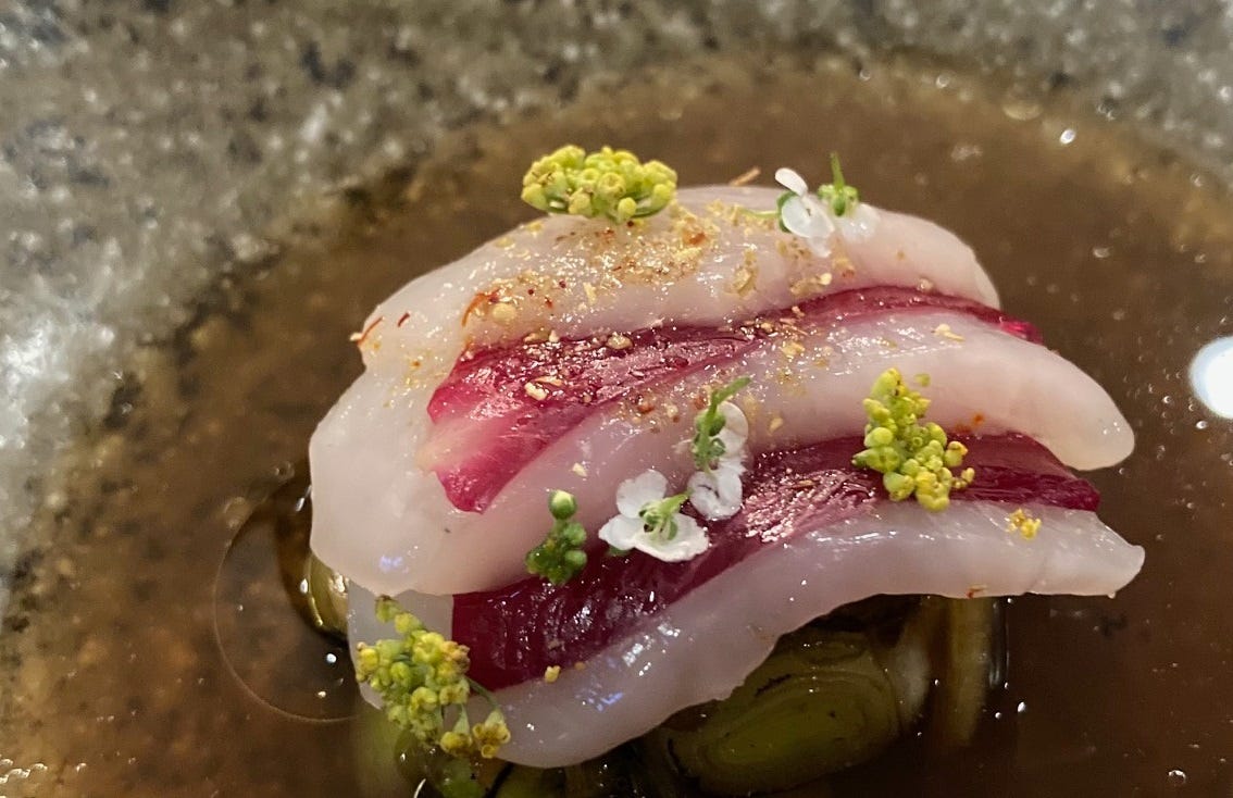 Raw scallop with rose petals and a fish broth at Forage Kitchen