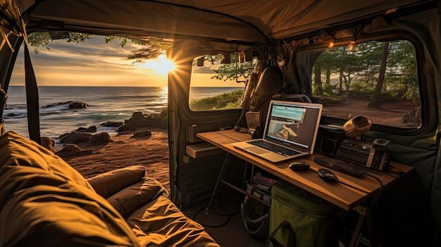 Premium AI Image | a tent with a laptop and a sunset on the horizon.