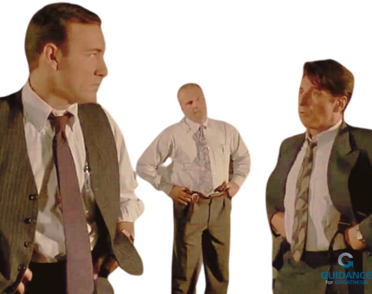 Three figures from the movie in sepia tones with the background removed. Kevin Spacey is on the left in a tie and vest glaring at Al Pacino on his left. Pacino is on the right in a suit glaring back. In the rear facing forward is the police detective in a tie and shirt with no jacket. All three men have their hands on their hips and look angry.