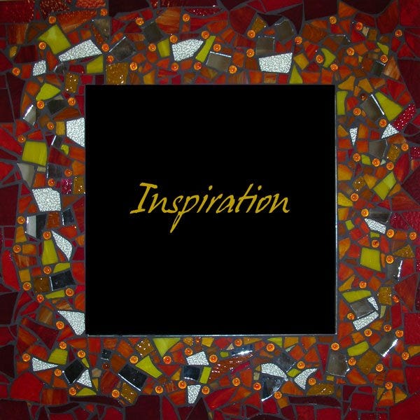 A mosaic tile with dark autumn colours by Helen Sword with the word 'Inspiration' at the centre