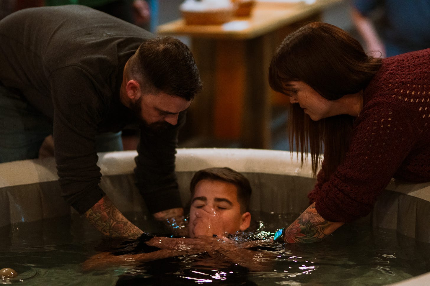 Ronnie & Cylia baptizing their son