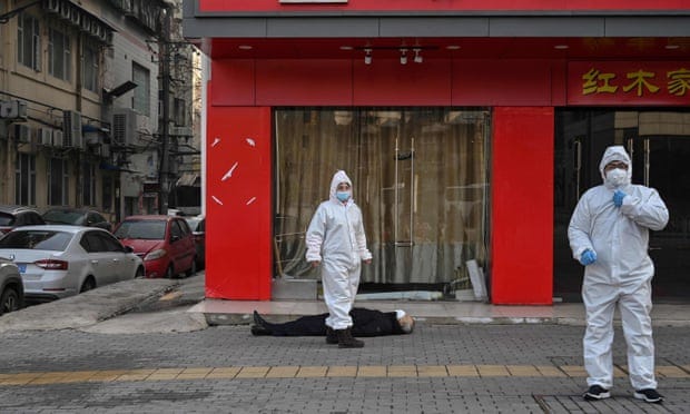 A man lies dead in the street: the image that captures the Wuhan  coronavirus crisis | Coronavirus | The Guardian