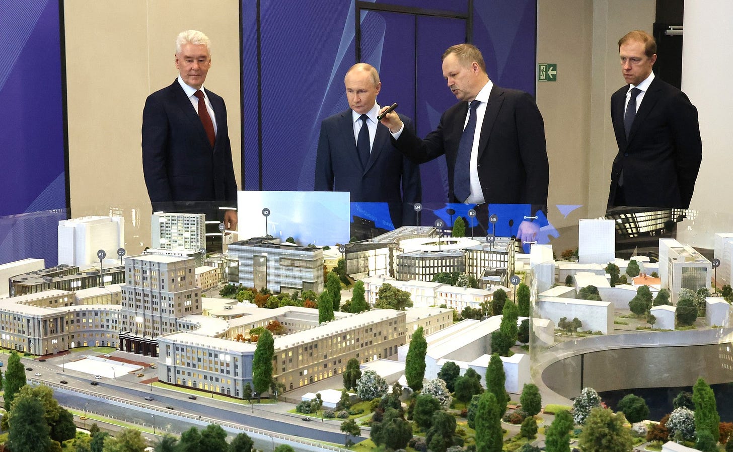 Visit to the Bauman Moscow State Technical University. With First Deputy Prime Minister Denis Manturov (right) and Moscow Mayor Sergei Sobyanin. Explanations are given by the rector of MSTU Mikhail Gordin. Photo: Sergey Karpukhin, TASS