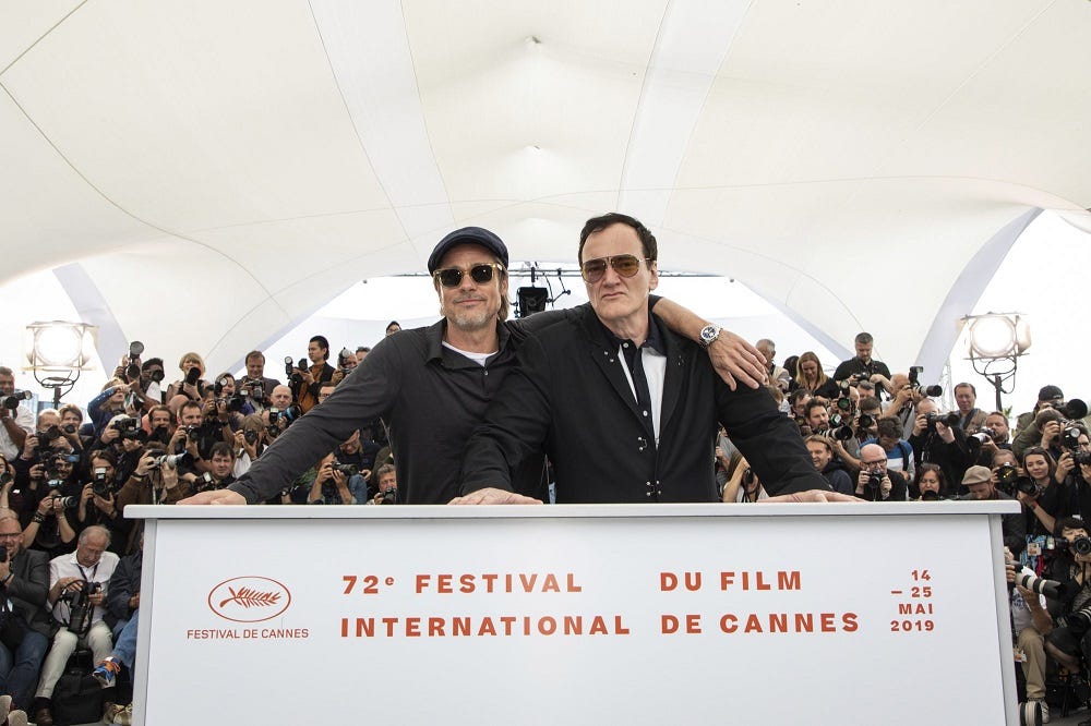 brad pitt poses with quentin tarantino at cannes once upon a time in hollywood