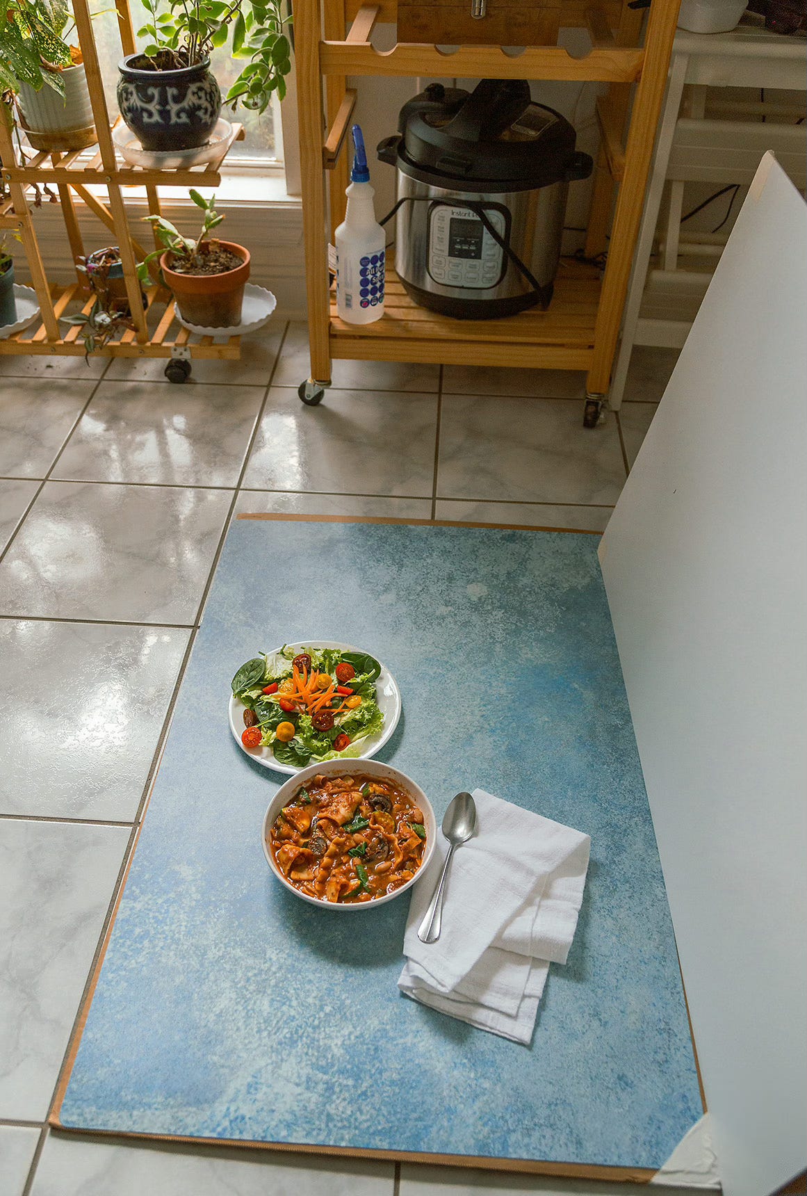 Background board and food set up on kitchen floor