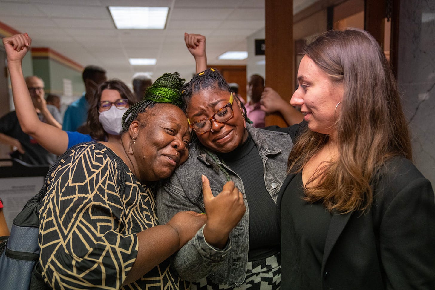 Marianna Brown, left, a driver for Uber and Lyft, embraced Minneapolis City Council Member Robin Wonsley on Thursday while she celebrated with her aid