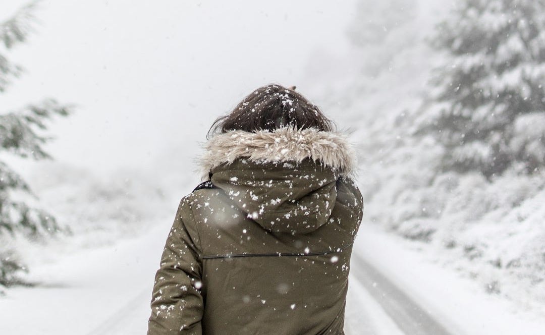 woman standing in front of road