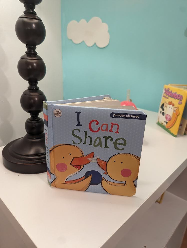 A picture of the toddler boardbook "I can share" with pullout pictures