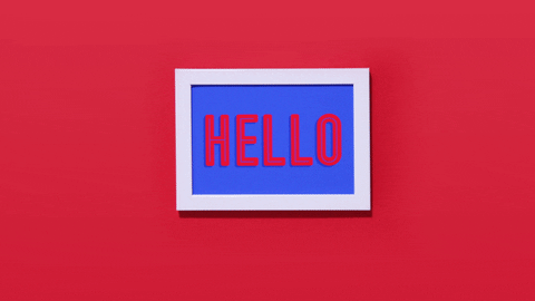 A finger straightens a sign that says hello. A finger straightens a sign that says hello.