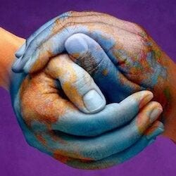Photo of a pair of hands holding each other. Each hand is painted in the colors of the globe with a purple background Photo of a pair of hands holding each other. Each hand is painted in the colors of the globe with a purple background