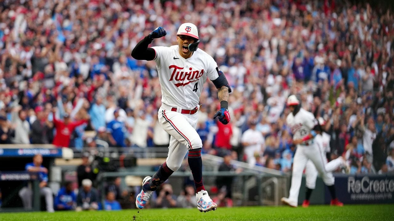 MINNEAPOLIS, MN - OCTOBER 04:  Carlos Correa #4 of the Minnesota Twins celebrates running to first base after hitting a RBI single in the fourth inning during Game 2 of the Wild Card Series between the Toronto Blue Jays and the Minnesota Twins at Target Field on Wednesday, October 4, 2023 in Minneapolis, Minnesota. (Photo by Daniel Shirey/MLB Photos via Getty Images)