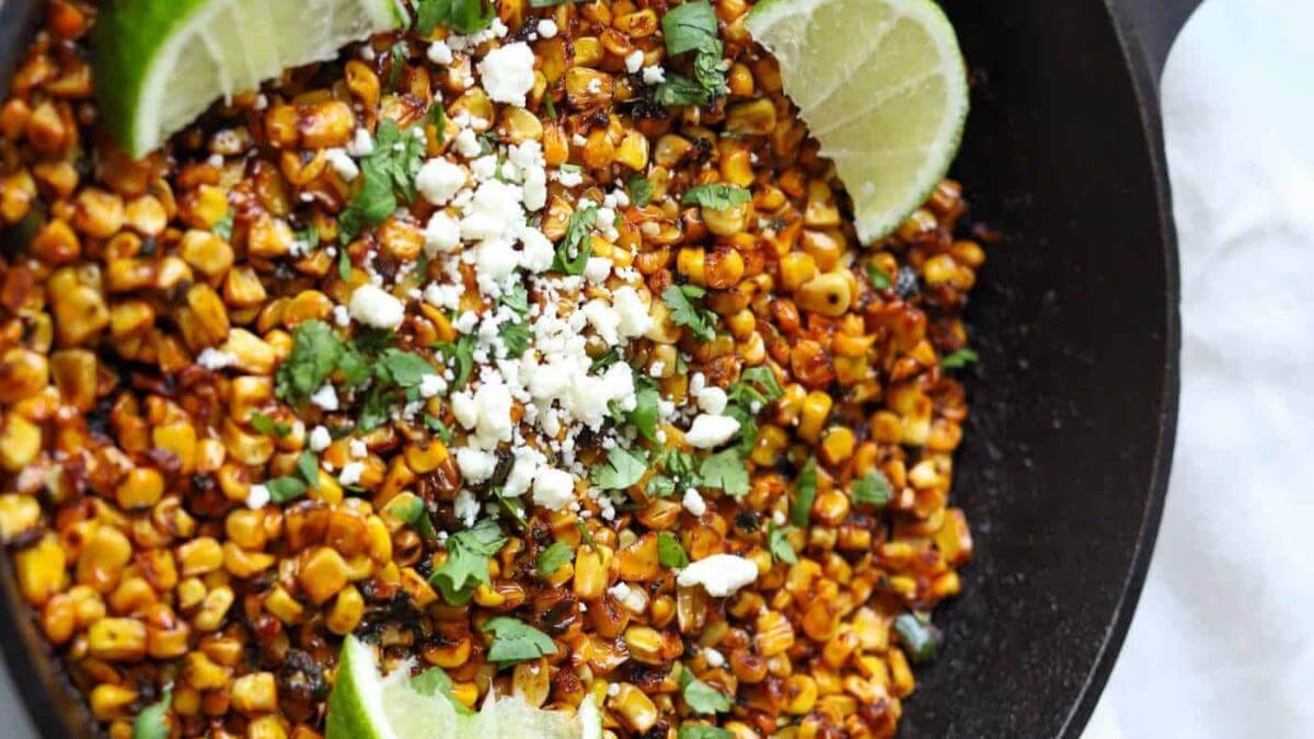 A skillet full of charred corn.