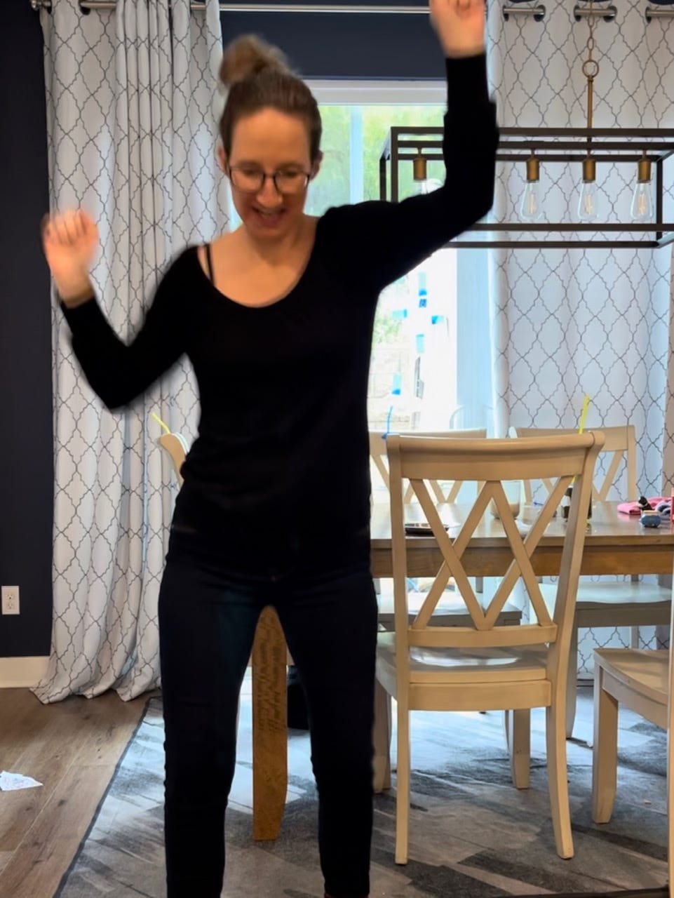 Aly dancing in her kitchen