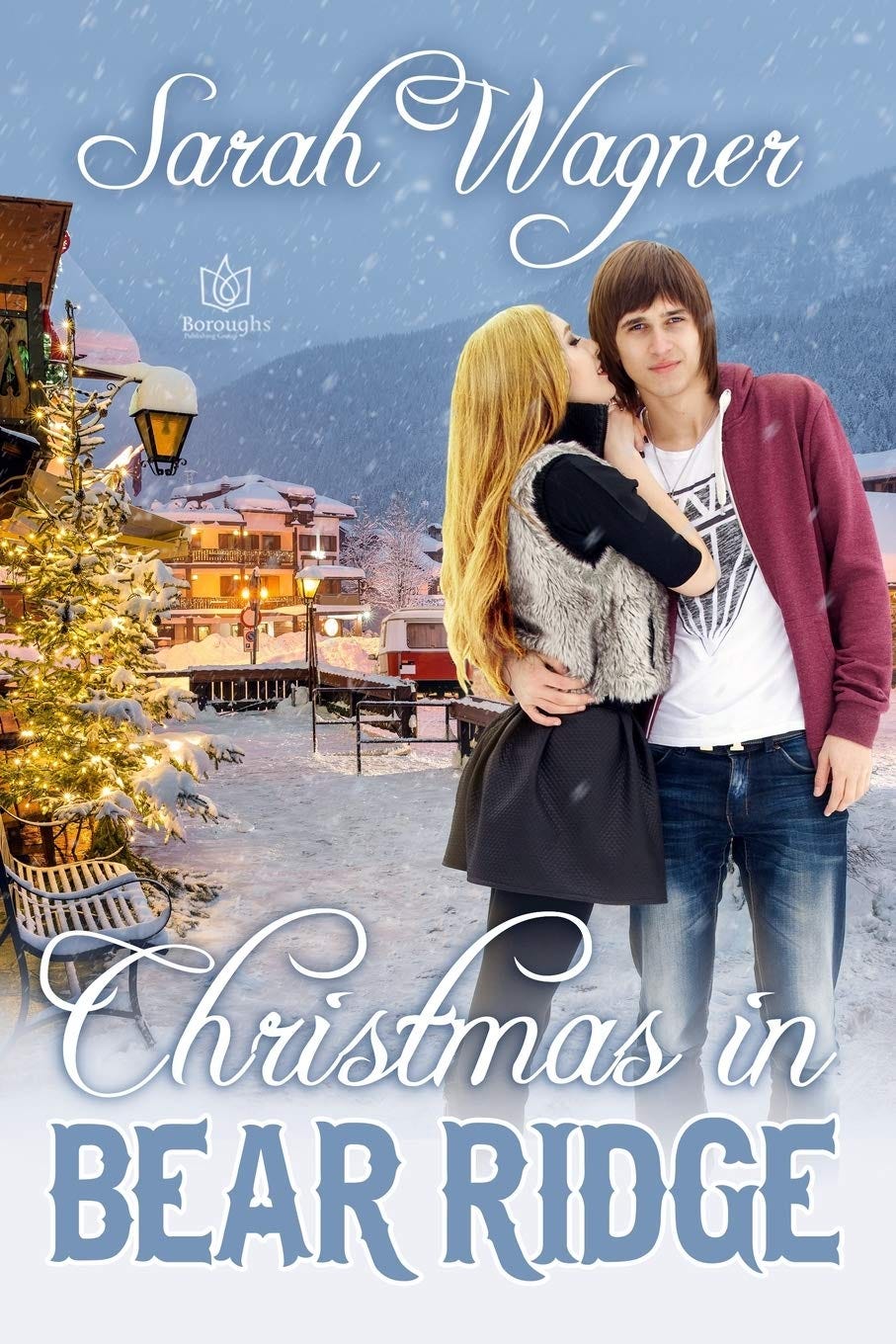cover image for Christmas in Bear Ridge by Sarah Wagner. A pretty small town decorated for christmas with a light snow falling. An International Harvester camper in the background. A young blond woman in a black skirt, leggings, and top with a white vest leans in to kiss a young man on the cheek. He is wearing jeans, a white graphic tshirt and a red hoodie. 