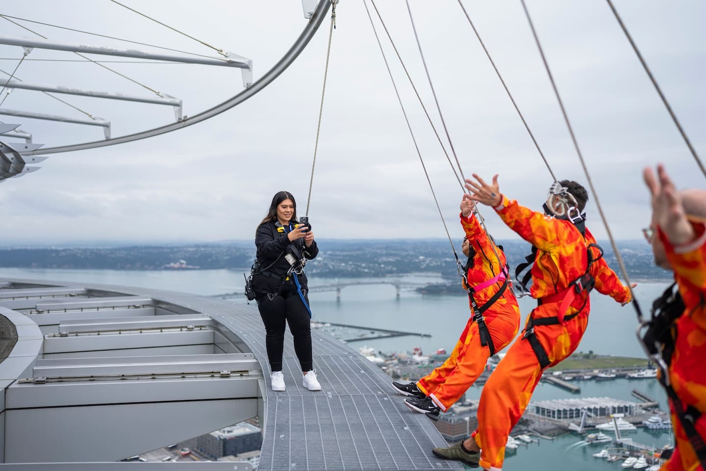 A guide using the new EpicShot Guide App  - part of a system that AJ Hackett Bungy NZ says was installed at a tenth of the cost of its previous set-up, but which can take better photos and video and instantly deliver them to TikTok-generation punters.