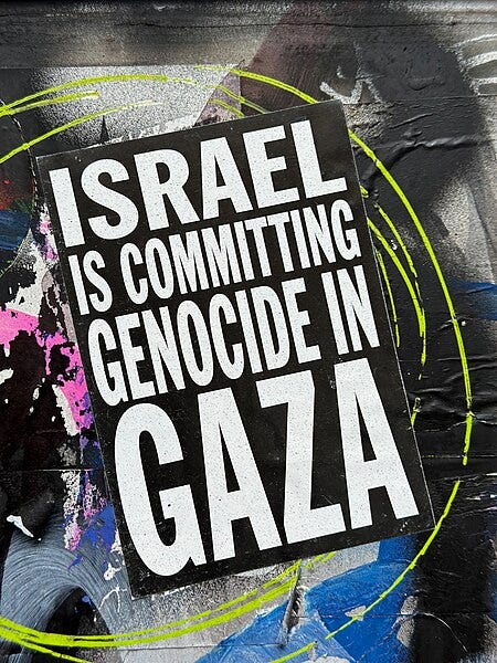 File:Political graffiti stickering "ISRAEL IS COMMITTING GENOCIDE IN GAZA".jpg