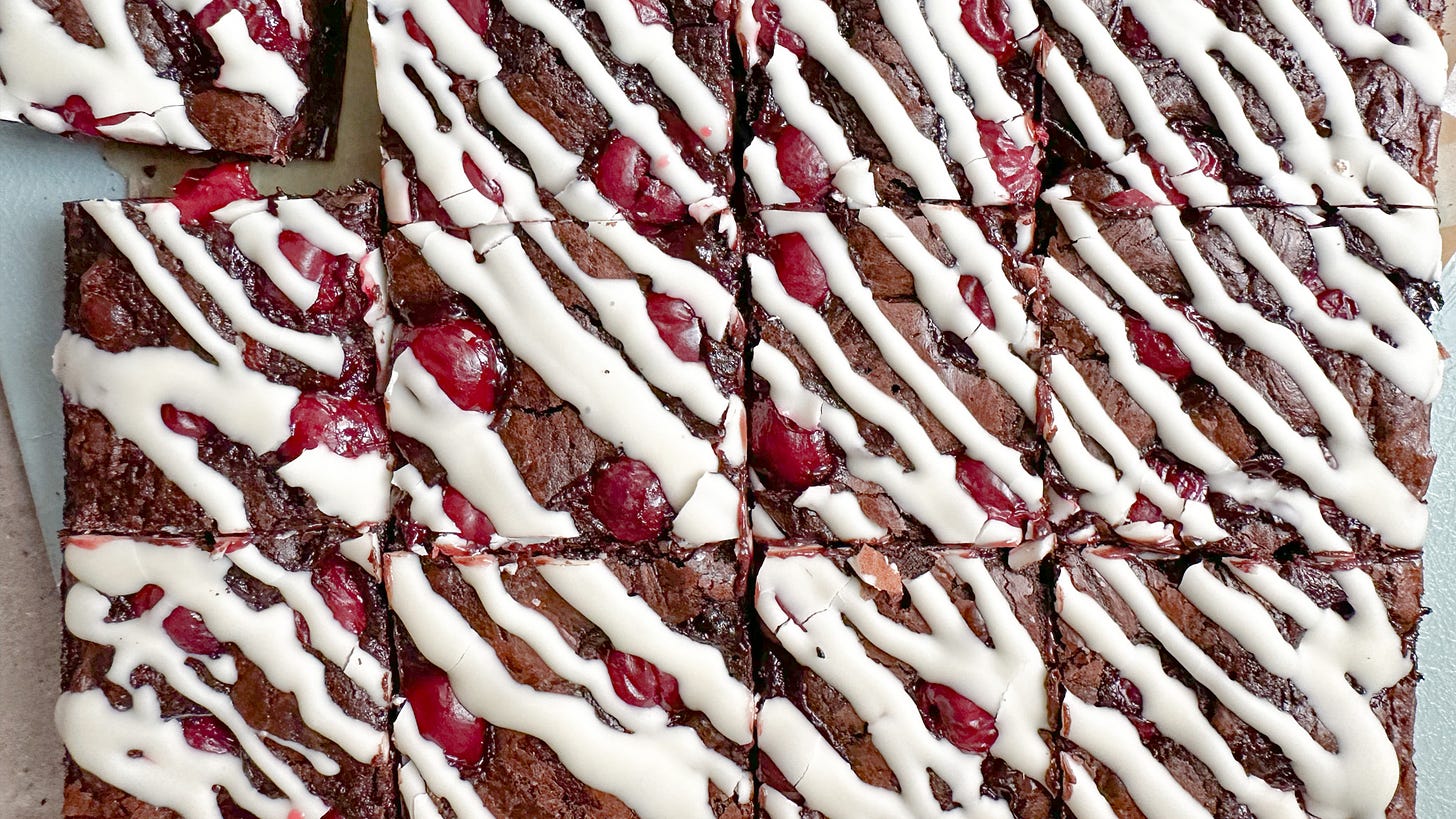 Black forest brownies with cherries and drizzled with white chocolate.