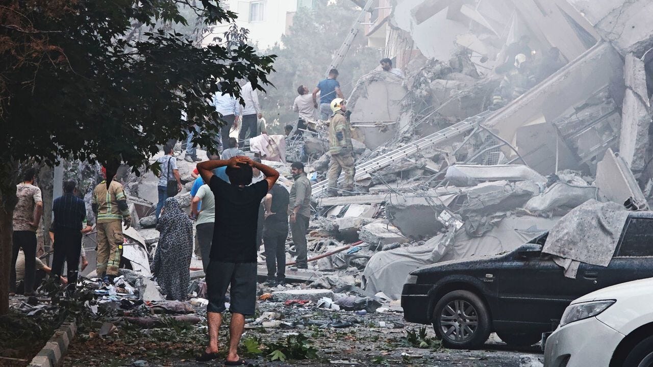 People look over damage to buildings in Nobonyad Square following Israeli airstrikes in Tehran, Iran People look over damage to buildings in Nobonyad Square following Israeli airstrikes in Tehran, Iran