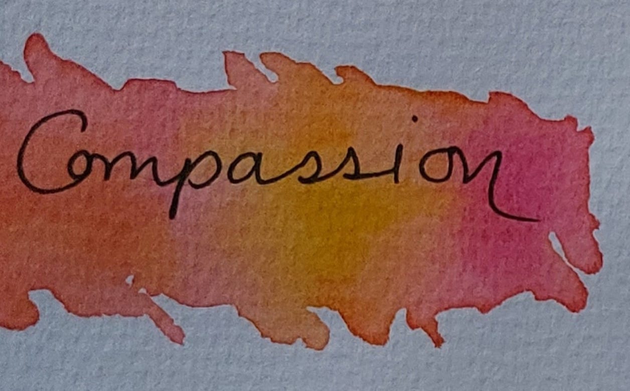 Compassion in orange, yellow, red watercolour