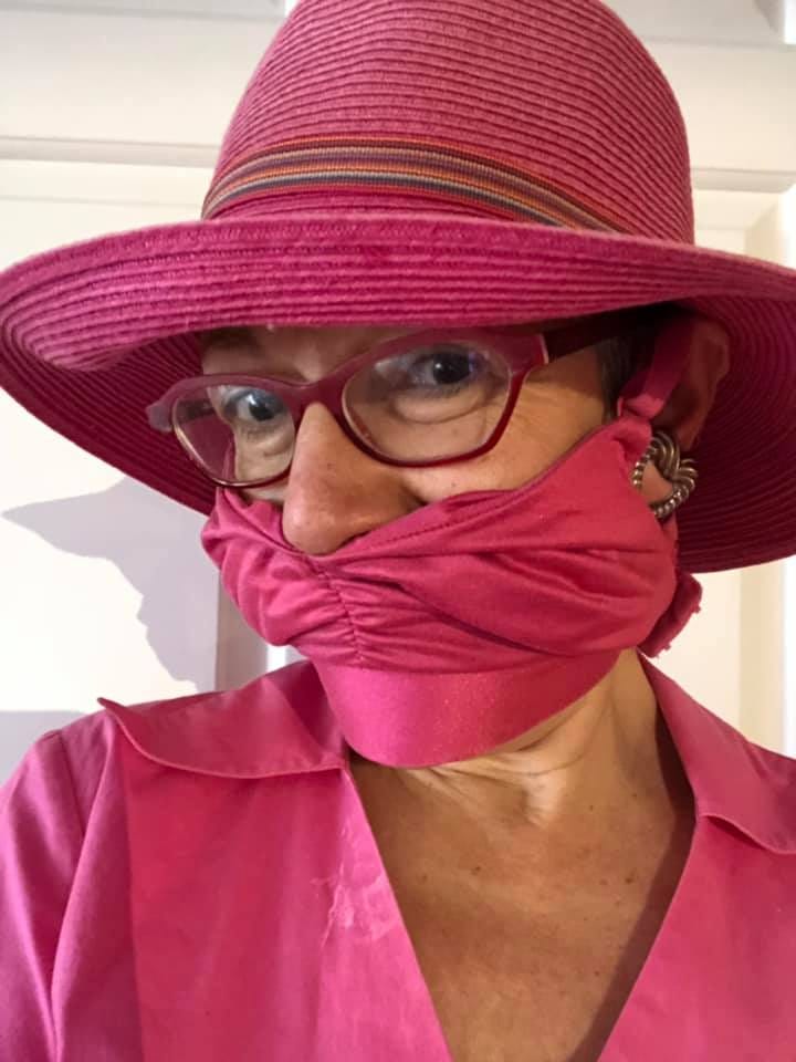 Woman wearing bra as mask